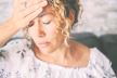 stockphotocloseupofwomantouchinghisfrontforheadacheorstressdiseasehealthcareandhealth2264262319.jpg