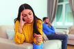 stockphotostressedwifeholdingherweddingringworriedaboutbreakupordivorceavoidtalkingwithhusband2240350081.jpg