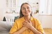 budite--zahvalni--stockphotohorizontalindoorimageofstylishseniorwomaninyellowjacketdoinggratefulgestureputting2103651269.jpg