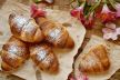 stockphotofrenchfreshcrustycroissantsonawoodentabletopview1952846647.jpg