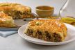 stockphotorolledbureksavourypiefithmeatandmushroomsfeelingdecoratedwithsesamseedespeaceof1873773613.jpg