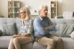 stockphotoannoyedignoringseniorcouplesittingonhomecouchbacktobacklookingawaykeepingsilence2349818671.jpg