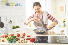 stockphotohealthyfoodathomehappywomanispreparingthepropermealinthekitchen1397470610.jpg