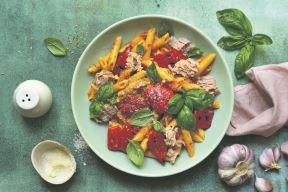 stockphotopastapennewithtunaandvegetablesintomatosauceinabowlovergreenslatestoneorconcrete1812202996.jpg