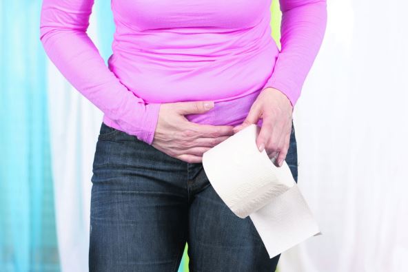 stockphotowomanwithstomachpainandtoiletpaperroll271367054.jpg